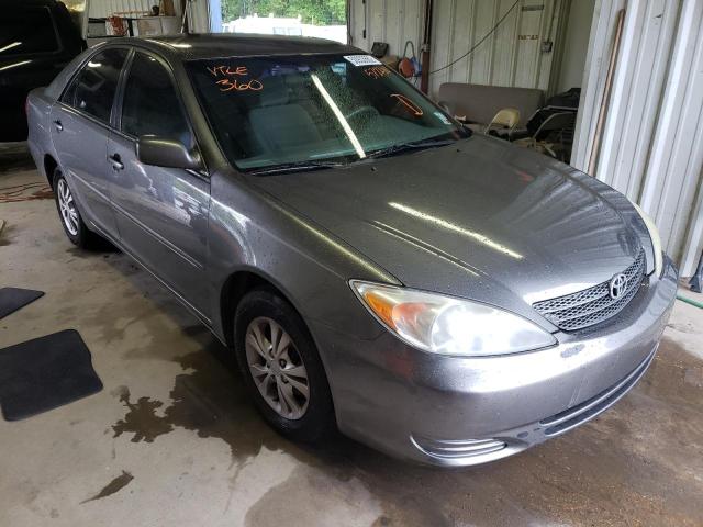 TOYOTA CAMRY LE 2004 with VIN 4T1BF32K54U572280 - Photo from auction