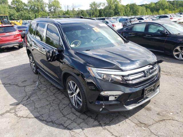 HONDA PILOT TOUR 2017 with VIN 5FNYF6H90HB063703 - Photo from auction