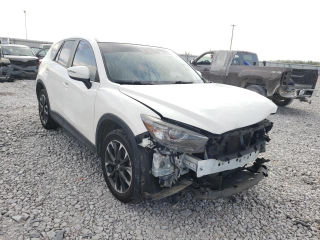 MAZDA CX-5 GT 2016 with VIN JM3KE4DY9G0861275 - Photo from auction