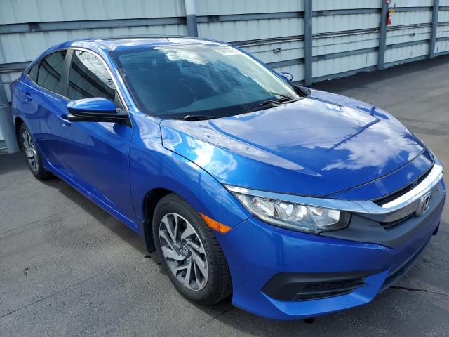 HONDA CIVIC EX 2018 with VIN 19XFC2F74JE030726 - Photo from auction