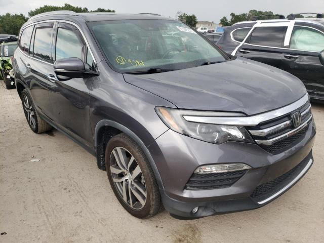 HONDA PILOT TOUR 2017 with VIN 5FNYF5H95HB002356 - Photo from auction