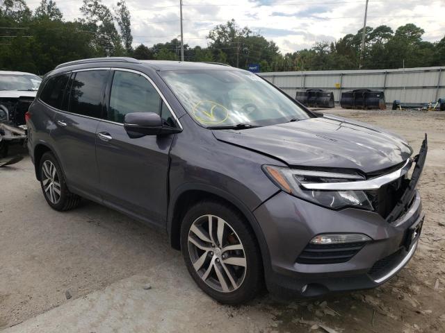 HONDA PILOT TOUR 2017 with VIN 5FNYF6H90HB034766 - Photo from auction