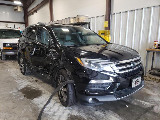 HONDA PILOT TOUR 2017 with VIN 5FNYF5H90HB037502 - Photo from auction