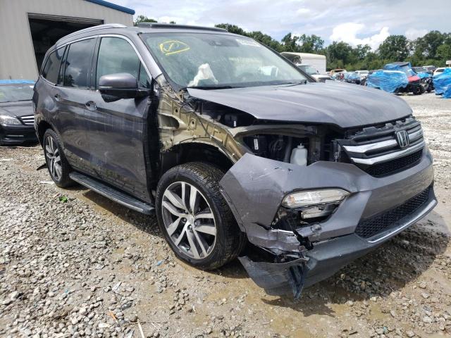 HONDA PILOT TOUR 2017 with VIN 5FNYF5H96HB001295 - Photo from auction