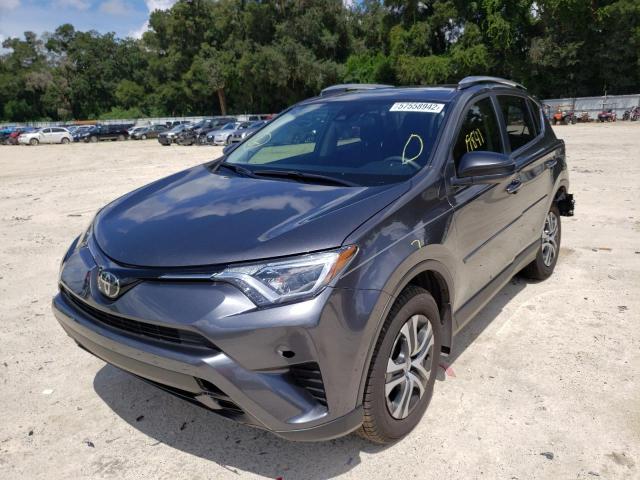 Photo 2 from auction – 2018 TOYOTA RAV4 LE with VIN JTMZFREV6JD130714