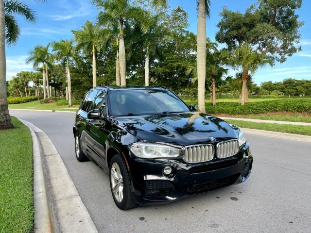 BMW X5 XDRIVE5 2014 with VIN 5UXKR6C56E0J72757 - Photo from auction