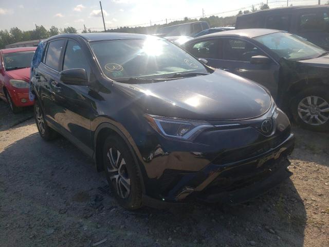 TOYOTA RAV4 LE 2018 with VIN 2T3BFREV7JW812909 - Photo from auction