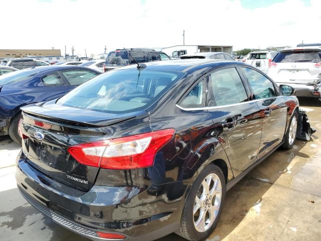Photo 4 from auction – 2014 FORD FOCUS TITA with VIN 1FADP3J22EL321676