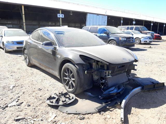 TESLA MODEL 3 2018 with VIN 5YJ3E1EB9JF144390 - Photo from auction