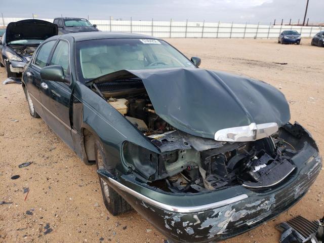 LINCOLN TOWN CAR E 2001 with VIN 1LNHM81W11Y738428 - Photo from auction