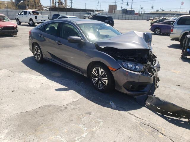 HONDA CIVIC EX 2018 with VIN JHMFC1F35JX037545 - Photo from auction