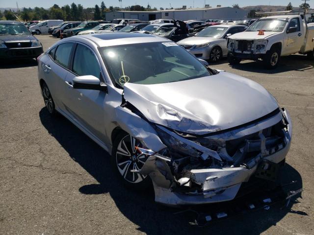 HONDA CIVIC EX 2018 with VIN 19XFC1F33JE201554 - Photo from auction