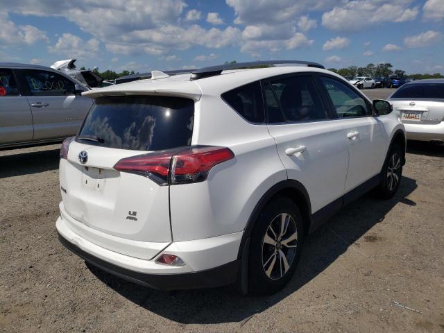 Photo 4 from auction – 2018 TOYOTA RAV4 LE with VIN 2T3BFREV8JW776616