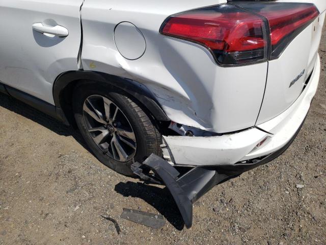 Photo 9 from auction – 2018 TOYOTA RAV4 LE with VIN 2T3BFREV8JW776616