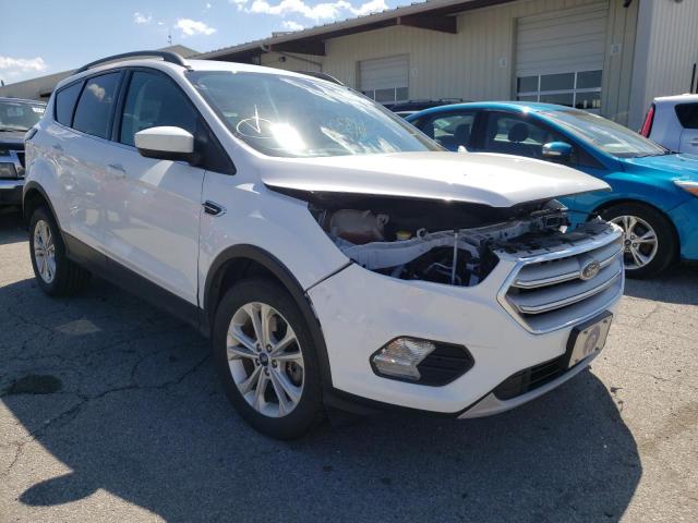 FORD ESCAPE SE 2018 with VIN 1FMCU9GD0JUC56112 - Photo from auction