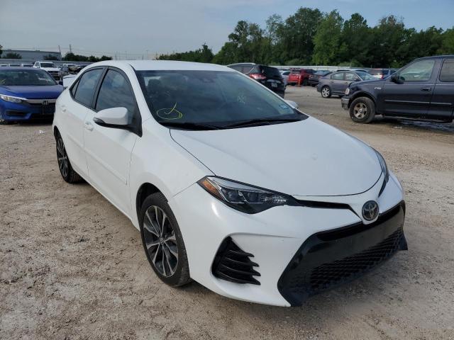 TOYOTA COROLLA L 2018 with VIN 5YFBURHE9JP764034 - Photo from auction