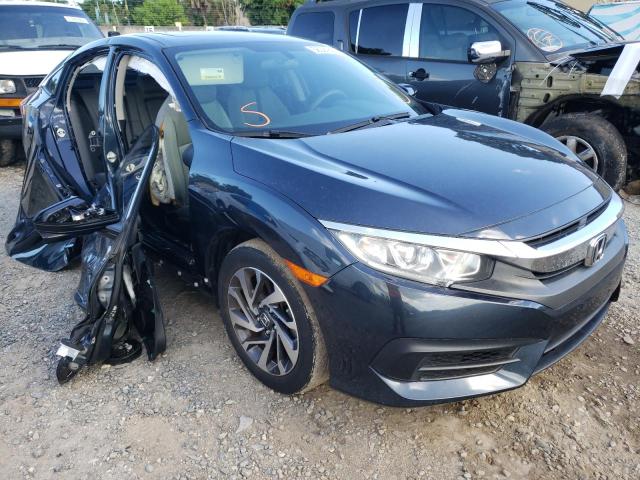 HONDA CIVIC EX 2018 with VIN 19XFC2F7XJE004700 - Photo from auction