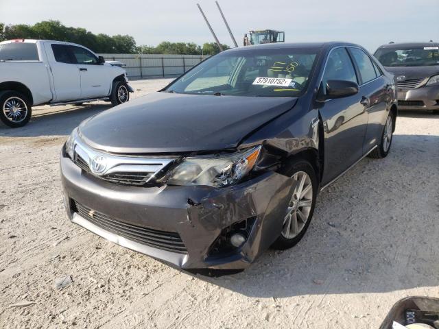 Photo 2 from auction – 2014 TOYOTA CAMRY HYBR with VIN 4T1BD1FK0EU117150
