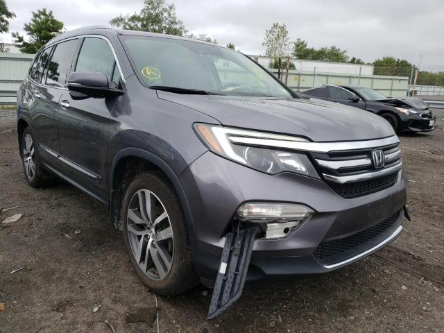HONDA PILOT TOUR 2017 with VIN 5FNYF6H97HB025644 - Photo from auction