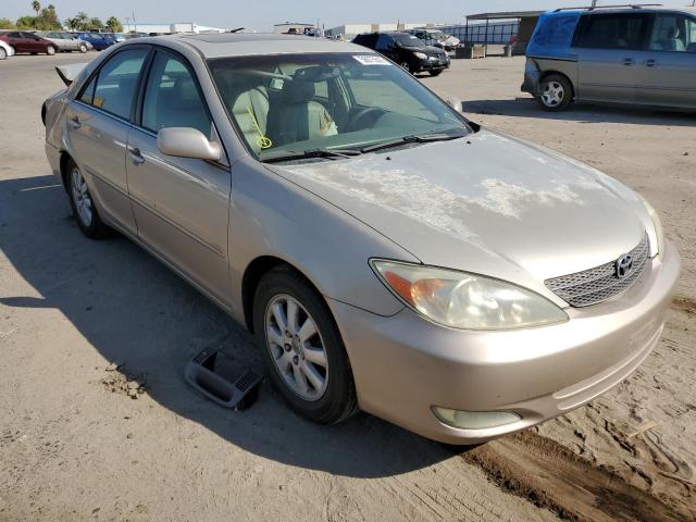TOYOTA CAMRY LE 2004 with VIN 4T1BF30K54U074907 - Photo from auction
