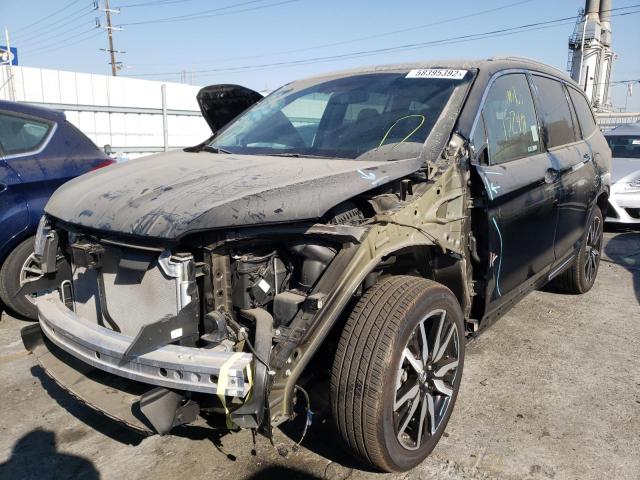 Photo 2 from auction – 2021 HONDA PILOT TOUR with VIN 5FNYF5H95MB020172