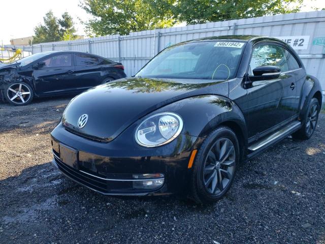 Photo 2 from auction – 2014 VOLKSWAGEN BEETLE with VIN 3VWJX7AT2EM631089