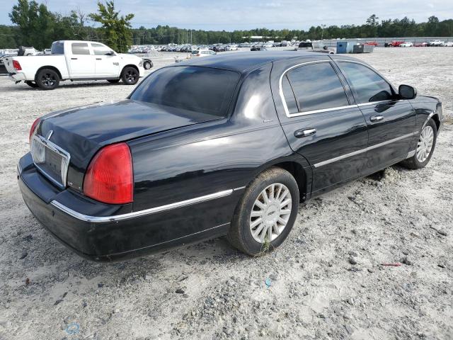 Photo 4 from auction – 2004 LINCOLN TOWN CAR U with VIN 1LNHM83W54Y673665