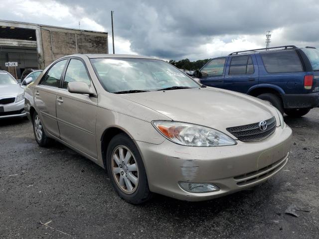 TOYOTA CAMRY LE 2004 with VIN 4T1BF30K34U571499 - Photo from auction