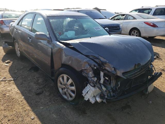TOYOTA CAMRY LE 2003 with VIN 4T1BF30K83U555278 - Photo from auction