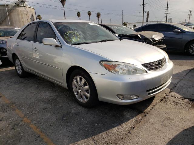 TOYOTA CAMRY LE 2003 with VIN 4T1BF30K63U553027 - Photo from auction