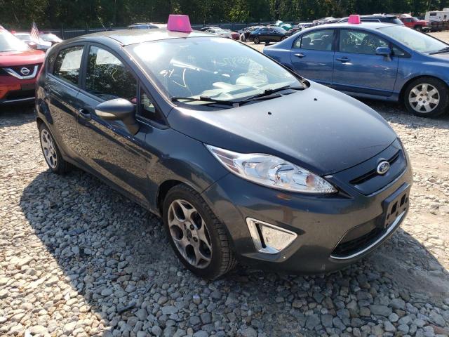 FORD FIESTA SES 2011 with VIN 3FADP4FJ2BM106914 - Photo from auction