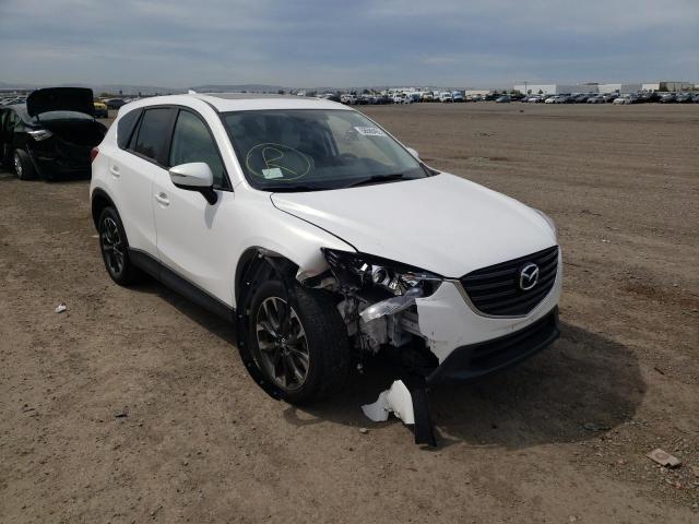 MAZDA CX-5 GT 2016 with VIN JM3KE2DY1G0764382 - Photo from auction