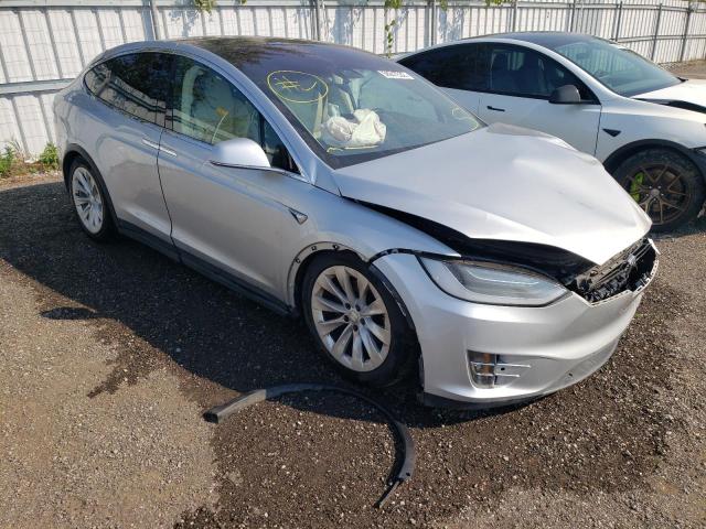 TESLA MODEL X 2017 with VIN 5YJXCAE21HF056662 - Photo from auction