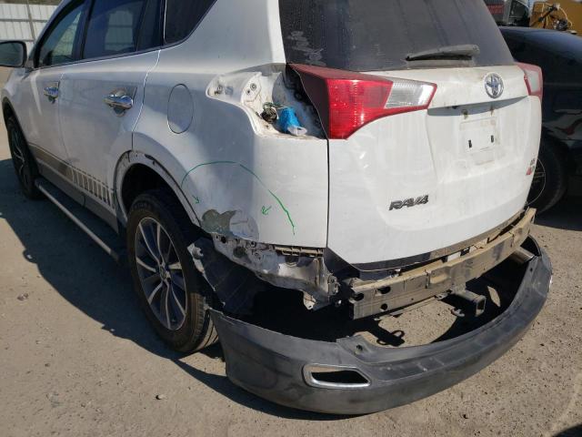 Photo 9 from auction – 2014 TOYOTA RAV4 LE with VIN JTMZFREV7ED035116