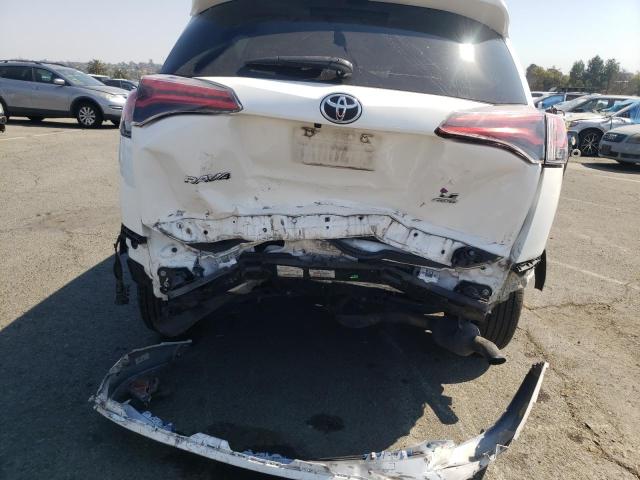 Photo 9 from auction – 2018 TOYOTA RAV4 LE with VIN JTMBFREV7JJ183036