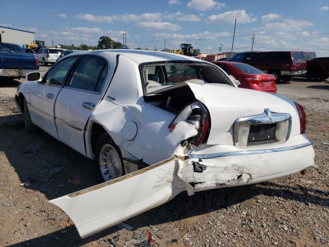 Photo 9 from auction – 1999 LINCOLN TOWN CAR E with VIN 1LNHM81W2XY632952