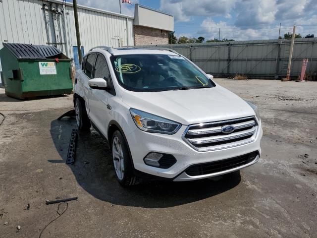 FORD ESCAPE TIT 2017 with VIN 1FMCU0J91HUD64054 - Photo from auction