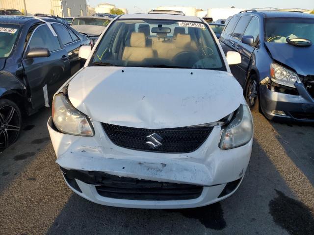 Photo 9 from auction – 2012 SUZUKI SX4 LE with VIN JS2YC5A3XC6302886