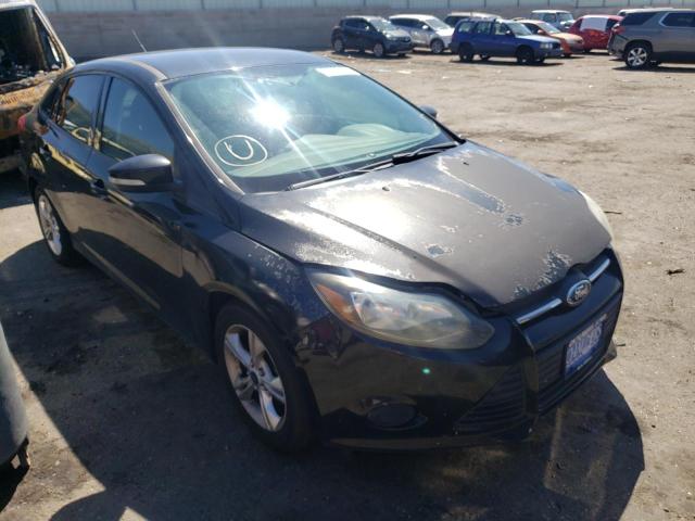 FORD FOCUS SE 2014 with VIN 1FADP3F21EL197649 - Photo from auction
