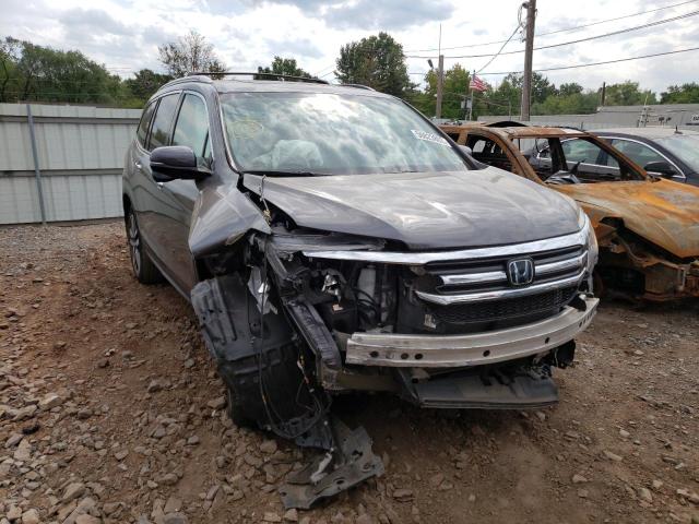 HONDA PILOT TOUR 2018 with VIN 5FNYF6H98JB026985 - Photo from auction