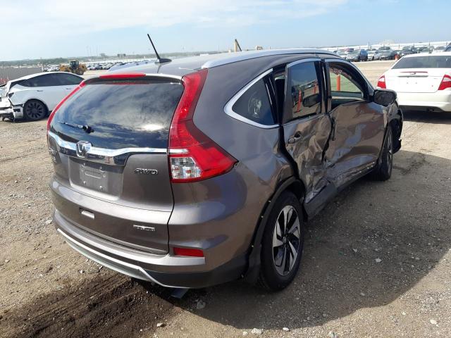 Photo 4 from auction – 2015 HONDA CR-V TOURI with VIN 5J6RM4H99FL128227