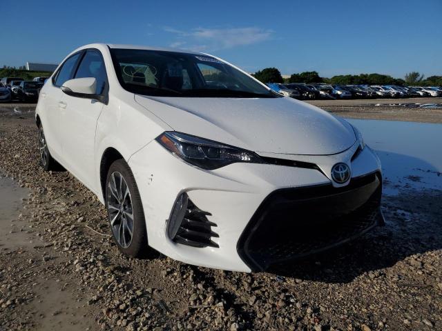 TOYOTA COROLLA SE 2018 with VIN 5YFBURHE3JP843697 - Photo from auction