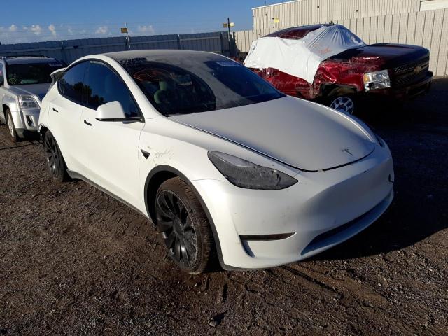 TESLA MODEL Y 2022 with VIN 7SAYGDEF1NF325982 - Photo from auction