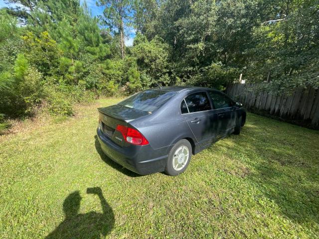 Photo 3 from auction – 2006 HONDA CIVIC HYBR with VIN JHMFA36256S014148