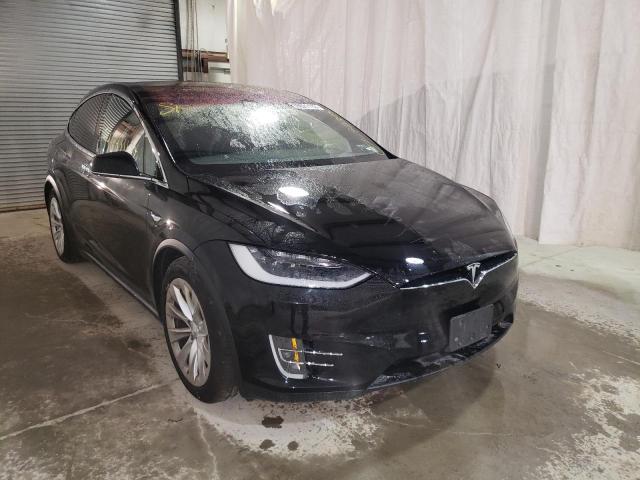 TESLA MODEL X 2018 with VIN 5YJXCAE24JF141386 - Photo from auction