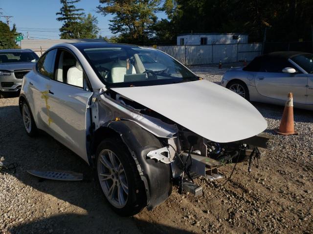 TESLA MODEL Y 2022 with VIN 7SAYGAEE9NF384171 - Photo from auction