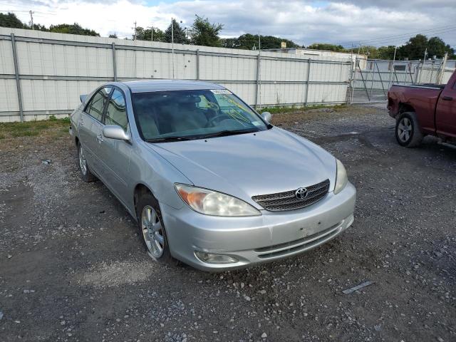 TOYOTA CAMRY LE 2004 with VIN 4T1BE30K74U910879 - Photo from auction