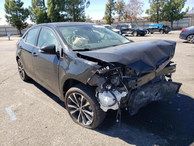 TOYOTA COROLLA L 2018 with VIN 5YFBURHE7JP785450 - Photo from auction