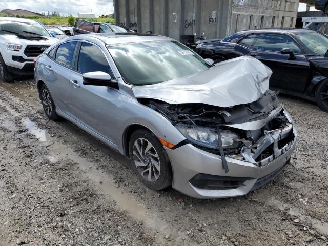 HONDA CIVIC EX 2018 with VIN 19XFC2F79JE002615 - Photo from auction