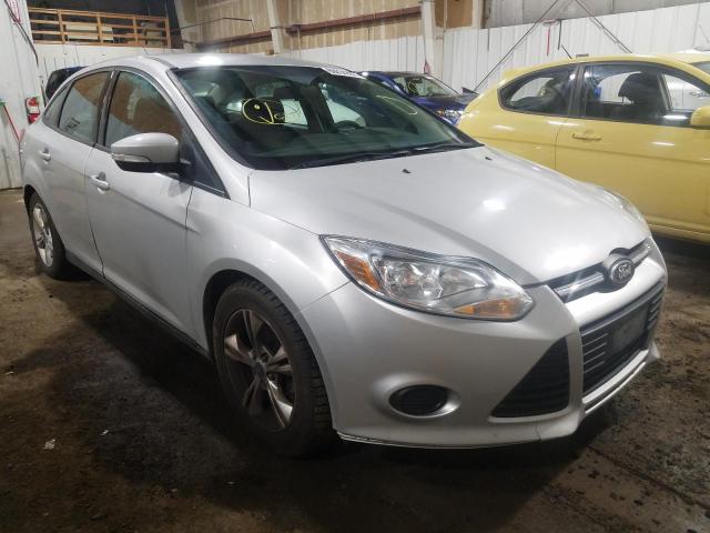 FORD FOCUS SE 2014 with VIN 1FADP3F24EL318108 - Photo from auction